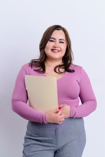 Woman holding a folder at JC Accounting and Tax Services